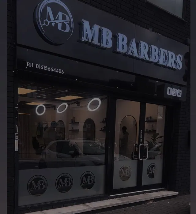 The shopfront lit up at night